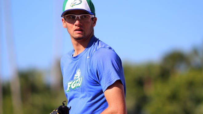 Kelli Krebs/The News-PressFGCU baseball freshman Devin Smeltzer is a cancer survivor who has his sights set on a career in the major leagues. FGCU baseball freshman Devin Smeltzer prepares to pitch while practicing in the bullpin during an FGCU baseball practice Tuesday afternoon at Swanson Stadium.