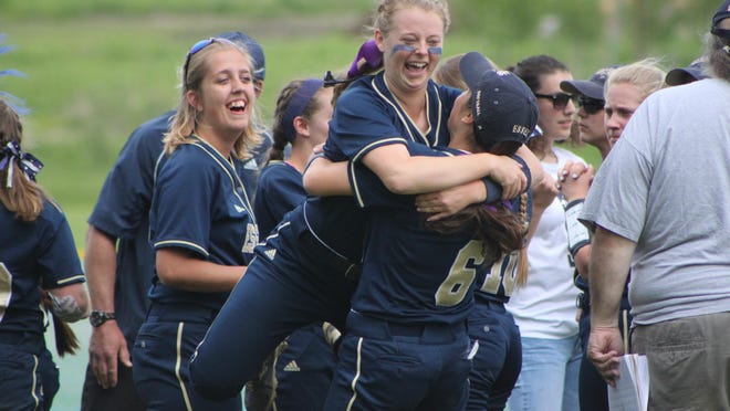 Essex’s Victoria Bean celebrates with a teammate after the Hornets walked off to win the Division I high school softball semifinals over Colchester on Wednesday.