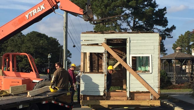 The first of four parts of renowned carver Miles Hancock's workshop is transported from his former home off Deep Hole Road on Chincoteague, Virginia to the Museum of Chincoteague Island grounds on Tuesday, Nov. 14, 2017.