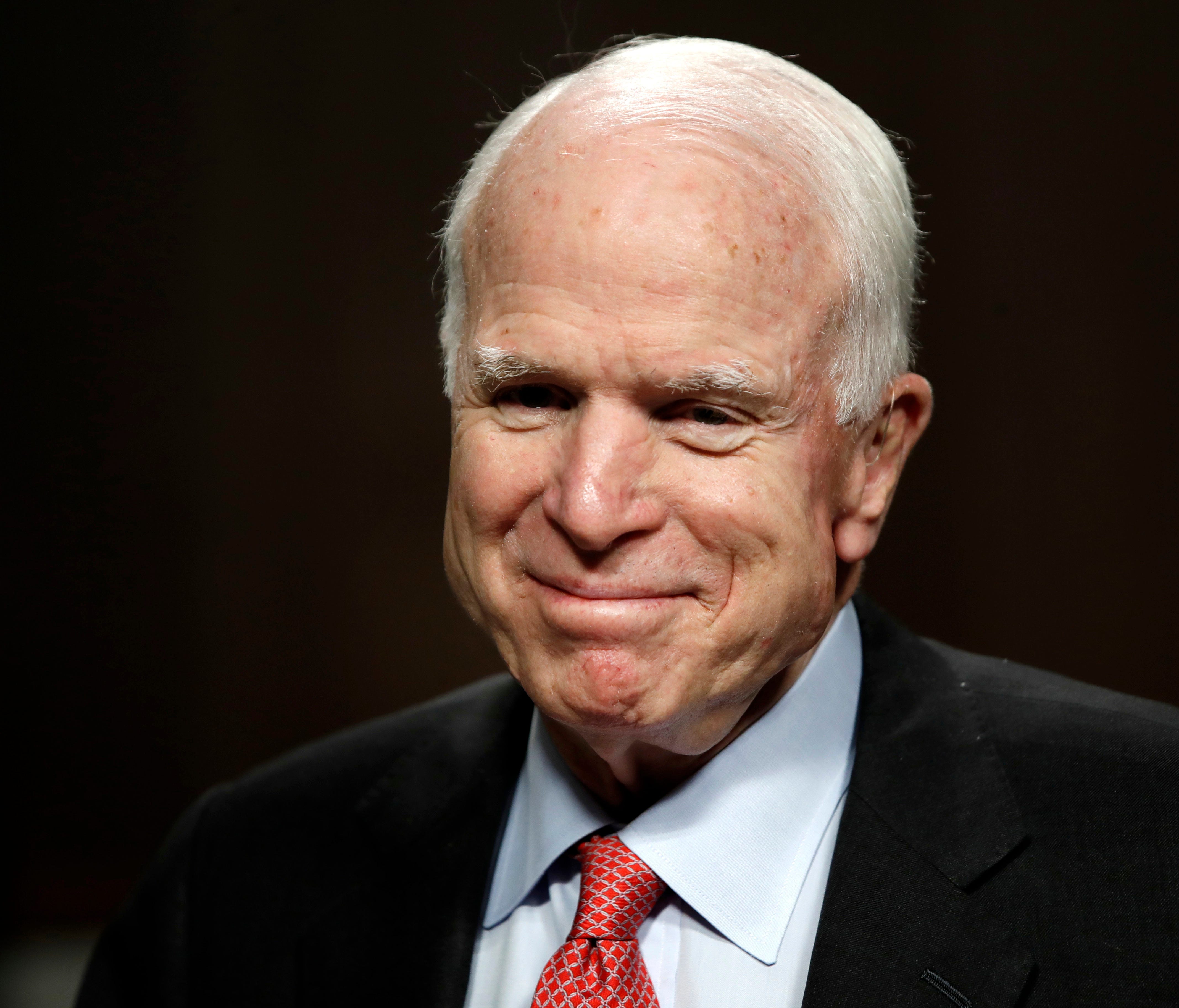 In this July 11, 2017, file photo, Sen. John McCain, R-Ariz., arrives on Capitol Hill in Washington. McCain has been diagnosed with a brain tumor after a blood clot was removed.