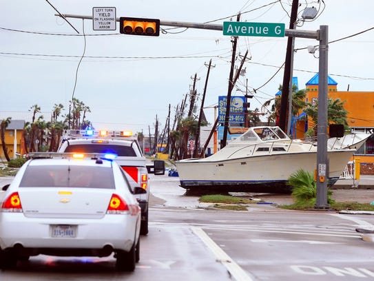 A boat sits in the road on Tuesday, Aug. 26, 2017 in Port Aransas, which was heavily damaged by Hurricane Harvey's high winds and rain.