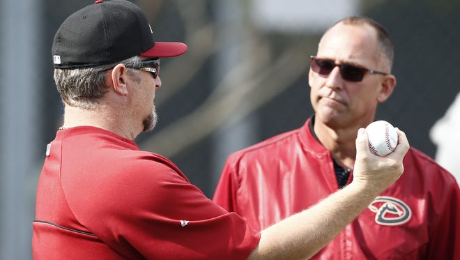 Arizona Diamondbacks scouting director Deric Ladnier (right) talks to Phil Nevin, manager of the D-Backs Triple-AAA team, the Reno Aces, at spring training practice on Tuesday, Feb..24, 2015, near Scottsdale.