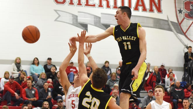 Tri-Valley's Jake McLoughlin blocks a shot against Sheridan during his junior season. McLoughlin signed with Ashland on Wednesday, one of three Scotties to ink college scholarship offers.