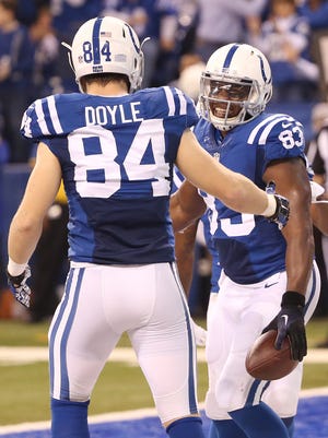 Indianapolis Colts tight end Dwayne Allen was all smiles after his first half touchdown as he celebrates with teammate Jack Doyle. Indianapolis hosted Houston at Lucas Oil Stadium Sunday, December 14, 2014.
