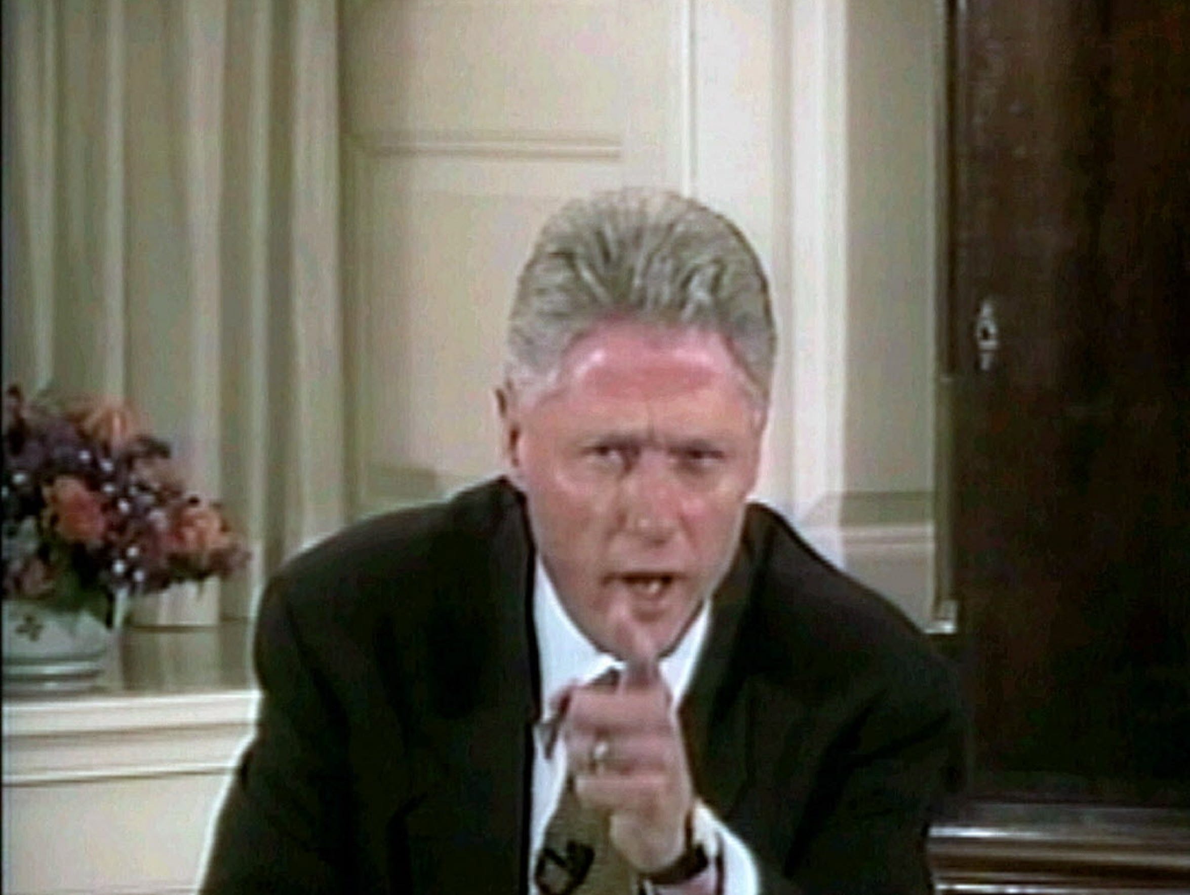 President Bill Clinton responds to a question on his