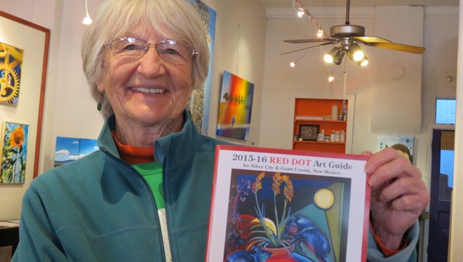 Lois Duffy displays the Silver City Art Association's 2015-16 Red Dot Art Guide. The 2016-17 Red Dot Art Guide will be published in July.