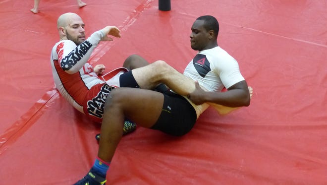 St. Preux wrestles with Isaac Fine at Knoxville Martial Arts Academy in September.