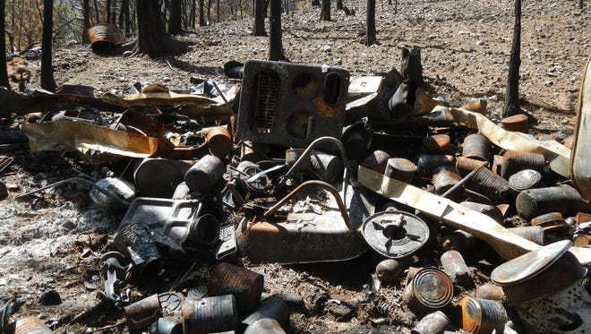 The remains of a cabin filled with explosives discovered during the Brian Head fire.