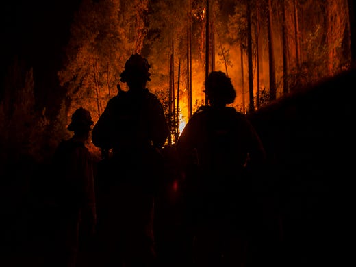 Firefighters preserve a watchful undercover agent on the Carr Fire as