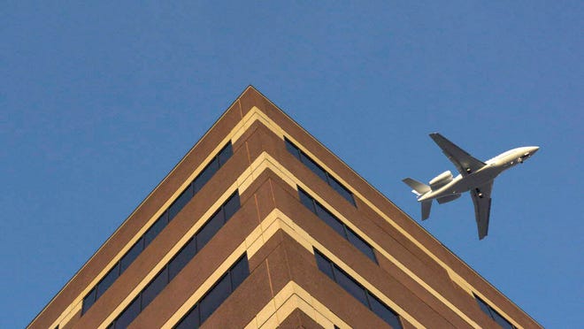 A plane flies over 20 Prospect Ave, a building at Hackensack University Medical Center, on Tuesday, March 8, 2016.