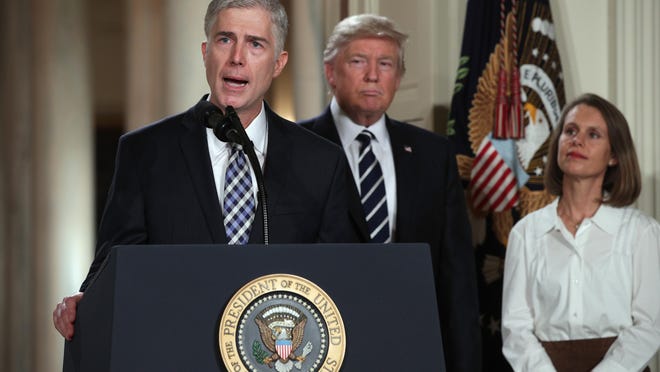 Judge Neil Gorsuch delivers brief remarks after being nominated by U.S. President Donald Trump to the Supreme Court with his wife Marie Louise Gorshuch during a ceremony in the East Room of the White House.