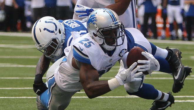 Lions running back Theo Riddick dives for the end zone against the Colts on Sunday.