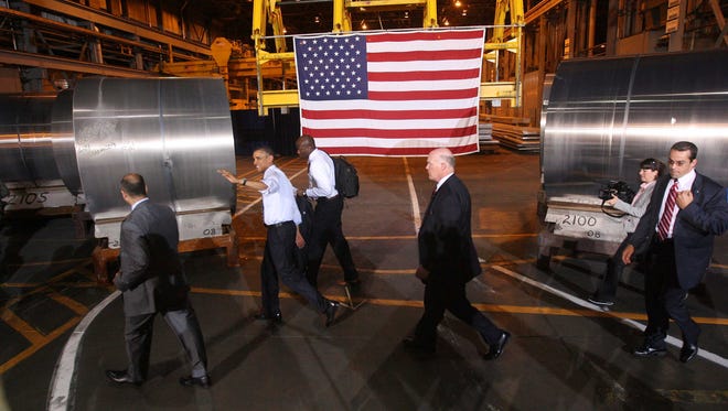 President Barack Obama tours the Alcoa's Davenport Works plant in this June 2011 photo.
