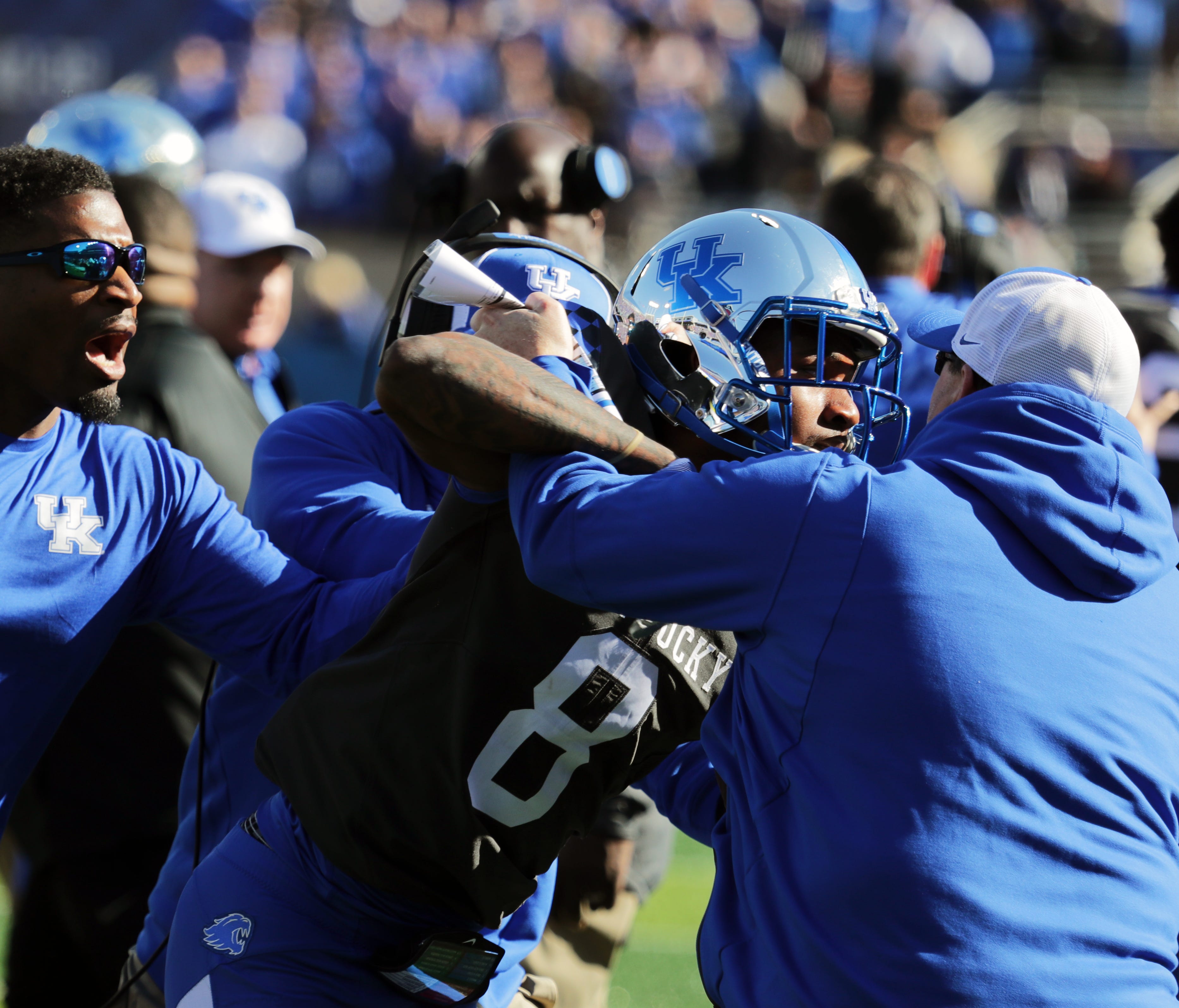 Kentucky's Derrick Baity Jr. had to be held back by his team after the scuffle.