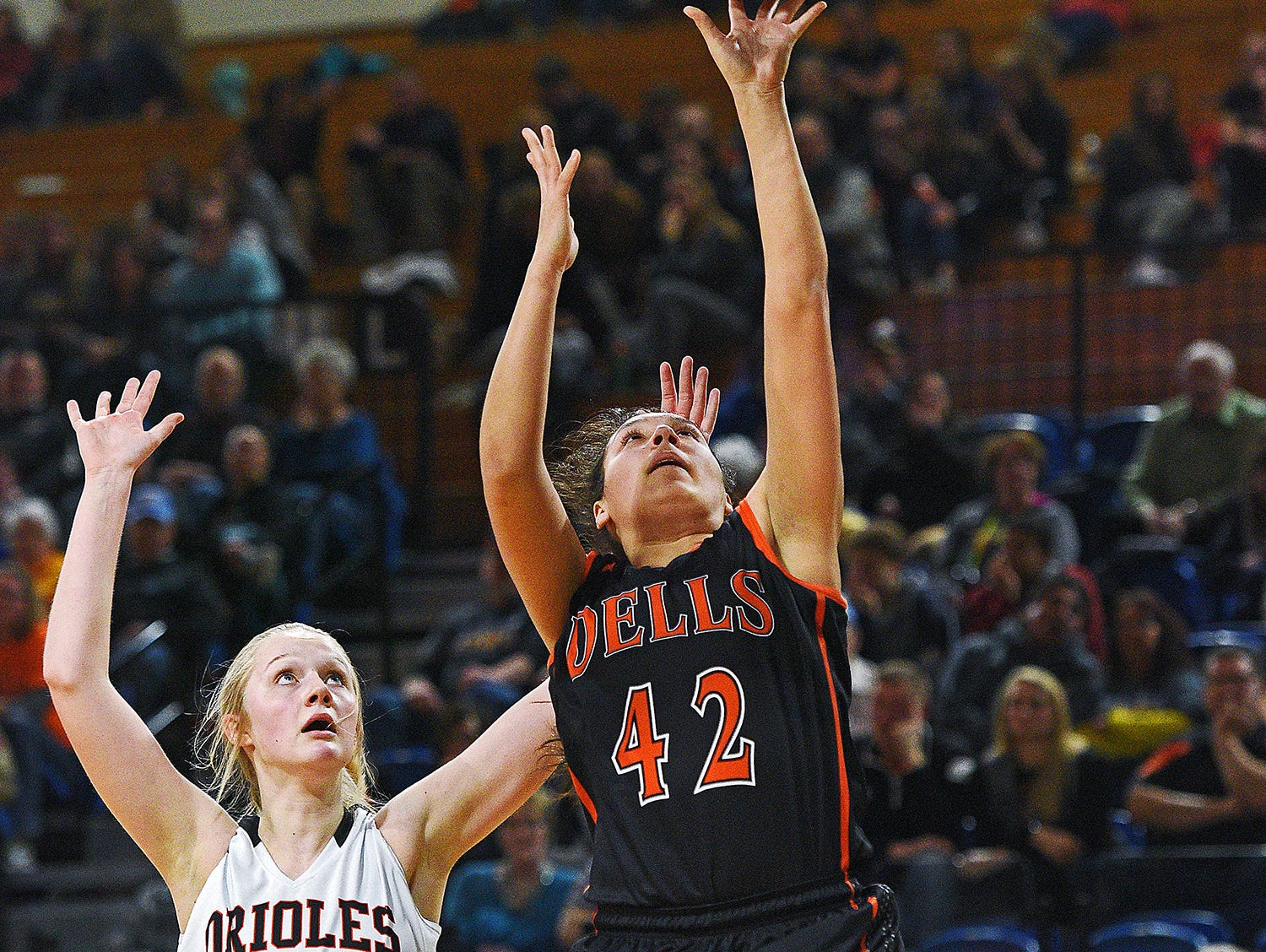 Dell Rapids' Jayda Knuppe (42) goes up for a shot in front of Lennox's Madysen Vlastuin (10) during a 2017 SDHSAA Class A State Girls Basketball Tournament quarterfinal game Thursday, March 9, 2017, at Frost Arena on the South Dakota State University campus in Brookings, S.D.