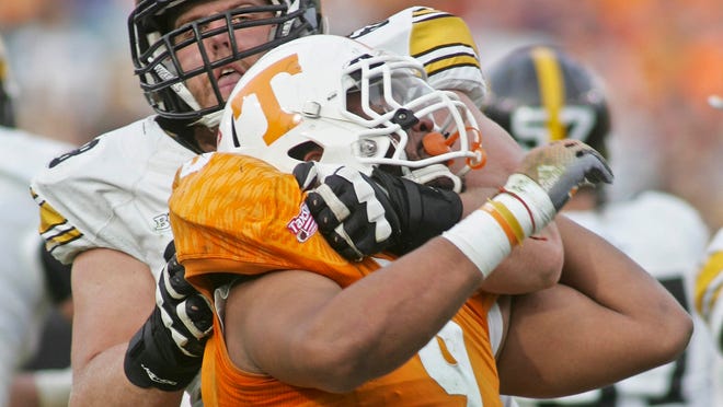 Iowa offensive tackle Brandon Scherff has his hands full as he tries to keep Tennessee defensive end Derek Barnett from getting to the quarterback in the TaxSlayer Bowl last January.