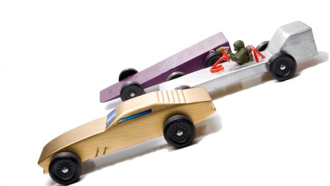 Wooden cars of the type typically used for the Pinewood Derby.