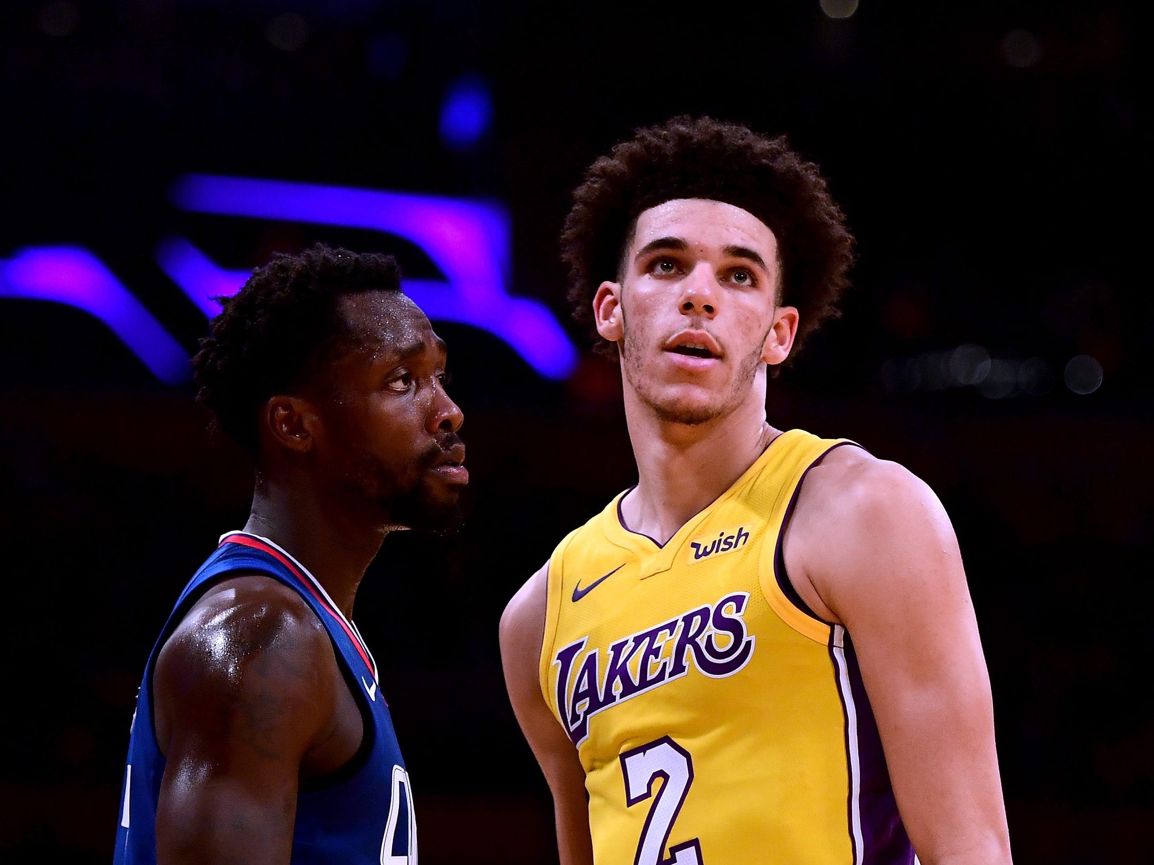 LOS ANGELES, CA - OCTOBER 19:  Lonzo Ball #2 of the Los Angeles Lakers is guarded by Patrick Beverley #21 of the LA Clippers during the first half of the Los Angeles Lakers home opener at Staples Center on October 19, 2017 in Los Angeles, California.