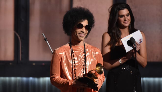 Prince presents album of the year at the 57th Grammy Awards in Los Angeles on Feb. 8, 2015.