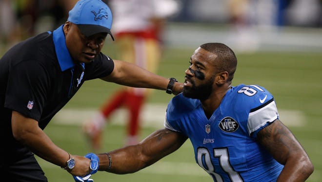 Head coach Jim Caldwell of the Detroit Lions shakes hands with Calvin Johnson #81 during warms up prior to play in gate San Francisco 49ers  at Ford Field on December 27, 2015 in Detroit.