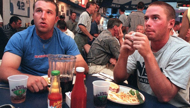 Matt Ortiz and Joe Inglett are shwon in 2000 as they watched the NCAA playoffs show at the Little Waldorf Saloon.