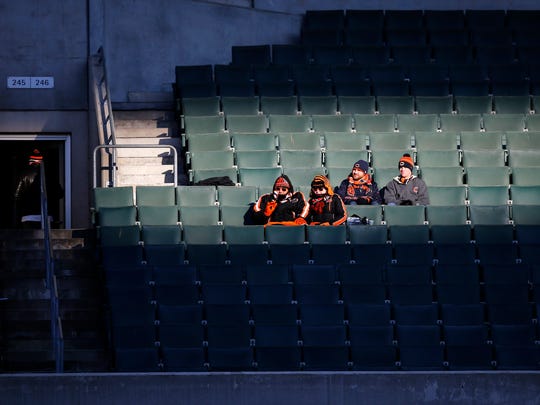 Two pairs of Cincinnati Bengals and Chicago Bears fans