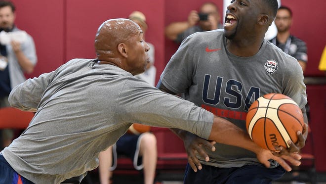 Draymond Green drives against assistant coach Monty Williams at Team USA practice. Green and Kevin Durant will be Warriors teammates.