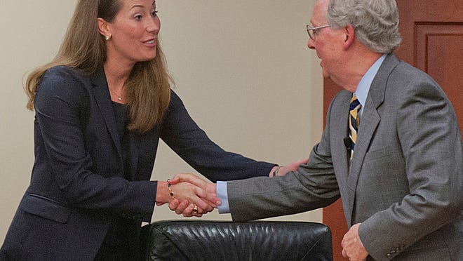 
Kentucky Secretary of State Alison Lundergan Grimes shakes hands with U.S. Sen. Mitch McConnell after debating him as part of the Kentucky Farm Bureau''s "Measure the Candidates" forum at the KFB headquarters in Louisville. 20 August 2014
