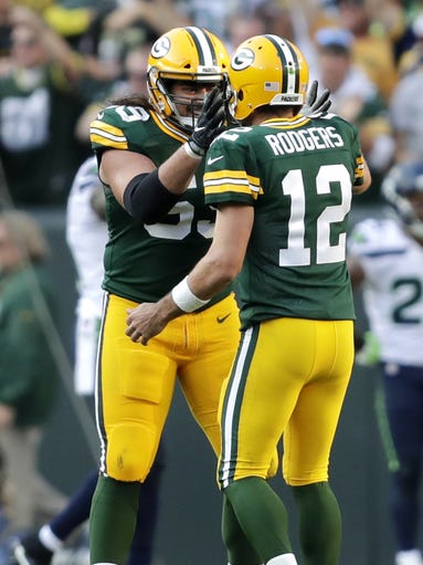 Green Bay Packers' David Bakhtiari(69) and Aaron Rodgers(12)