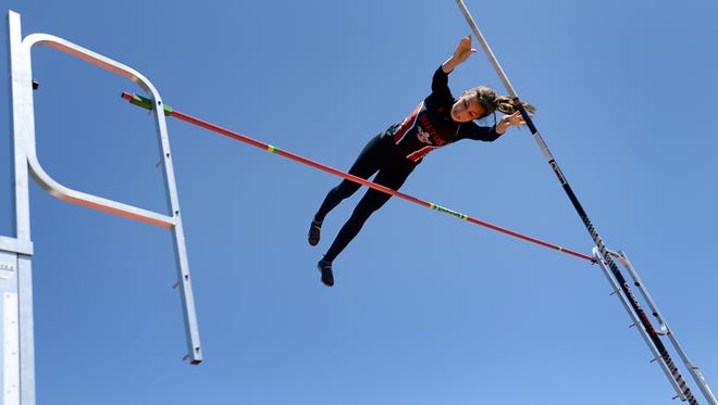 Hilton's Zoe Camillaci wins the pole vault with a height of 11-0 feet during the Monroe County Track & Field Championships,  held at Penfield High School on Saturday, May 23, 2015.