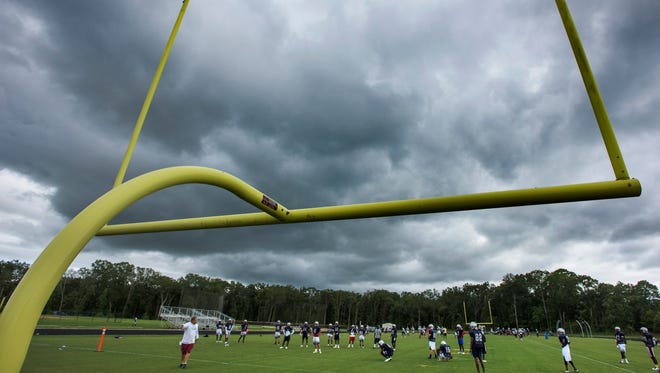 Dark skies over the Park Crossing football practice at the school in Montgomery, Ala. on Wednesday August 10, 2016. 