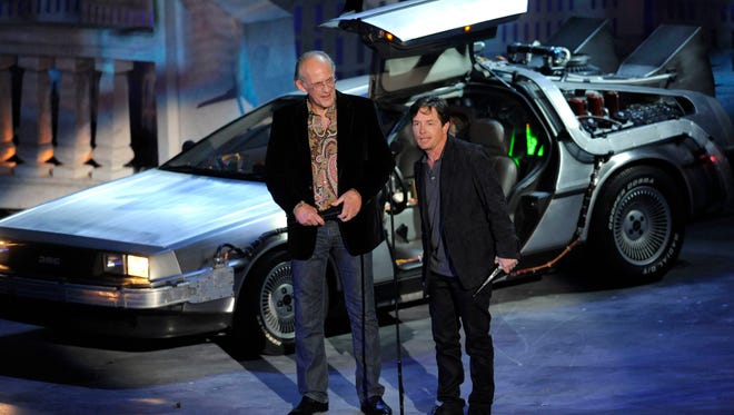 Michael J. Fox , right, and Christopher Lloyd accept the 25th Anniversary award for "Back To The Future" at the Scream Awards in 2010.