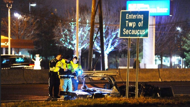 Police at the scene where a person was critically injured after being ejected from their vehicle which then caught fire on westbound Route 3 near the Interstate 495 junction in Secaucus, NJ.