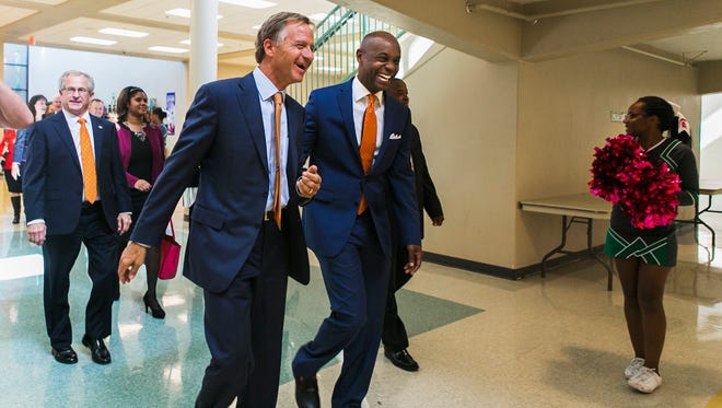 Gov. Bill Haslam shares a laugh with Shelby County Schools Superintendent Dorsey Hopson during an Oct. 27 visit to White Station Middle School.