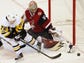 Arizona Coyotes goalie Antti Raanta (32) defends a