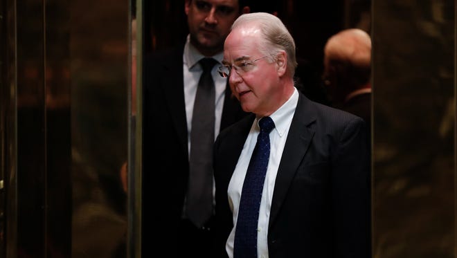 Elevators close on Rep. Tom Price, R-Ga., as he arrives at Trump Tower, Wednesday, Nov. 16, 2016, in New York.