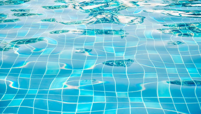 Blue ripped water in swimming pool.