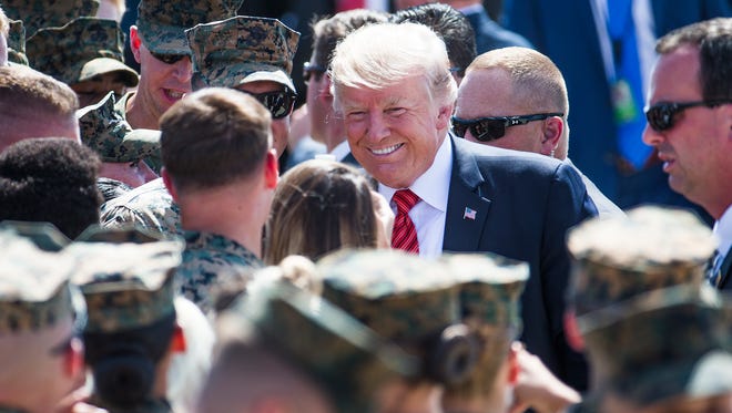 President Donald Trump greets Marines at the Marine Corps Air Station Yuma on Aug. 22, 2017. He will host a rally in downtown Phoenix in the evening.