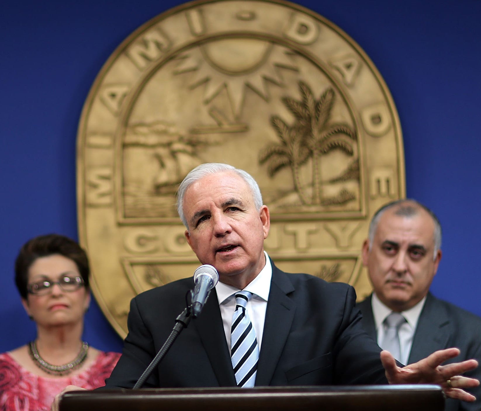 Miami-Dade County Mayor Carlos Gimenez (center) speaks during a hurricane preparedness press conference at the Miami-Dade County Emergency Operations Center on May 29, 2015 in Doral, Florida.