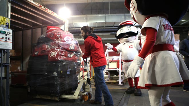Dustin Bradds, a GABP clubhouse attendant, helps load crates of equipment onto a trailer that is bound for Goodyear, Ariz.
