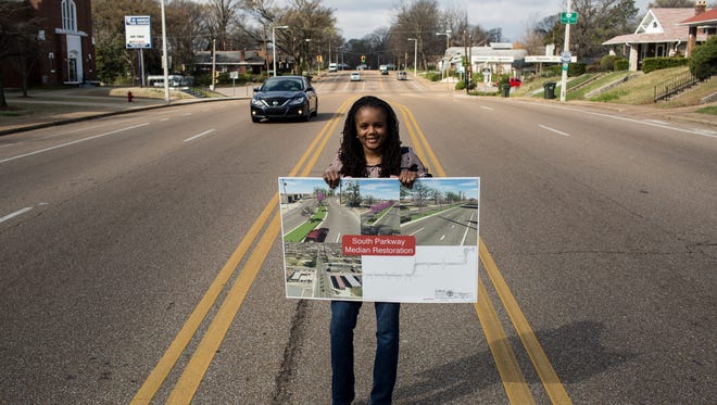 February 24, 2017 - Roshun Austin, executive director of The Works Inc., holds a sign of what the future median along South Parkway will look like while standing in the current median. Beginning this spring a $250,000 construction project funded by a grant from the Hyde Family Foundations will extend the South Parkway median from its present terminus near Gaither Street to about a mile westward, at Lauderdale. "It's a buffer, it will calm the traffic," Austin said. "But it's also about beautification and to feel safer as a pedestrian."