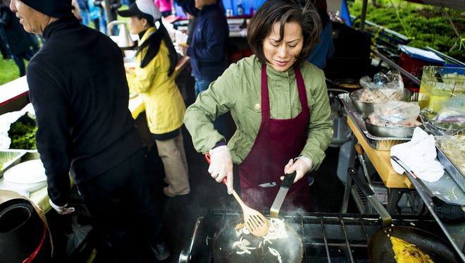 A volunteer from Our Lady of Lavang Vietnamese Church makes Banh xeo for the Asian Food Fest at Washington Park.
A volunteer from Our Lady of Lavang Church makes Banh xeo for The Asian Food Fest at Washington Park Saturday, May 14, 2016.