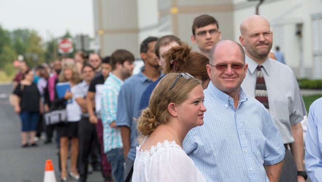 Thousands of people wait in line to apply for an Amazon job. Amazon, which plans to hire 50,000 workers nationwide to help keep up with their expanding business, held job fairs at several fulfillment centers, including Robbinsville. They plan to fill 1,500 jobs in New Jersey.