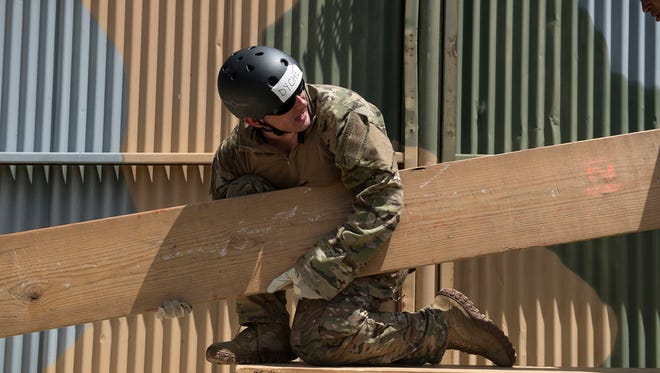 Air Force Special Operations Recruiter Tech Sgt. Drew Dyche figures out a puzzling leadership course obstacle during a 350th Battlefield Airman Training Squadron preparatory course at Joint Base San Antonio-Lackland in San Antonio, Texas June 28, 2018. Dyche experienced many of the same challenges presented to his recruits by the squadron.