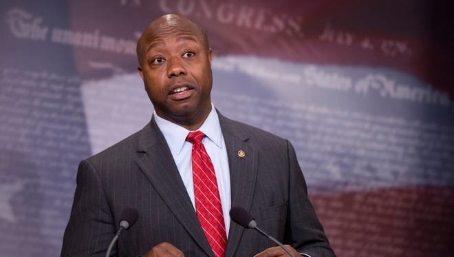 In this Nov. 5, 2015, photo, Sen. Tim Scott, R-S.C., speaks about the Guantanamo Bay Detention Facility during a news conference on Capitol Hill in Washington. The Senate is poised to pass a bill on Nov. 10, that bans moving Guantanamo Bay detainees to the United States, something Barack Obama has been trying to do since he was sworn in as president.  (AP Photo/Manuel Balce Ceneta)