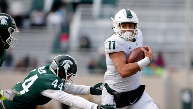 Connor Heyward rushes in the first half of MSU's spring game Saturday at Spartan Stadium.
