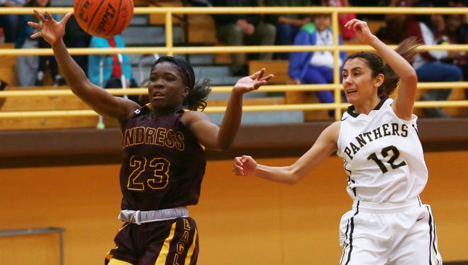 Andress' Alexis Singleton, left, and Austin's Ashley Lincon reach for a loose ball during the second quarter Tuesday.