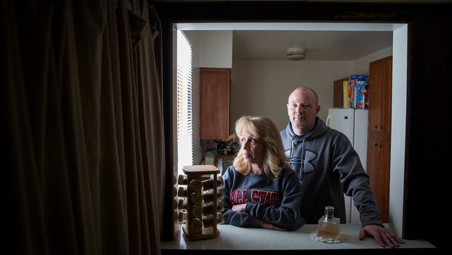 Tim Simmons with his wife at their home in Muncie Wednesday, Jan. 20, 2016. Simmons, who has fifteen years of experience working as a welder, claims he was fired from his job at Progress Rail after a coworker accused him of being a member of the terrorist organization ISIS. Simmons was investigated by a local federal officer following the incident and no evidence was found connecting him to the terrorist group.