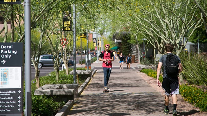 Students traverse city walkways between classes at ASU’s downtown campus.