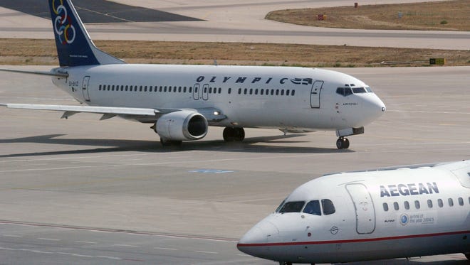 Aegean Airlines and Olympic Air aircraft at Athens International Airport in a file photo from Sept. 23, 2005.